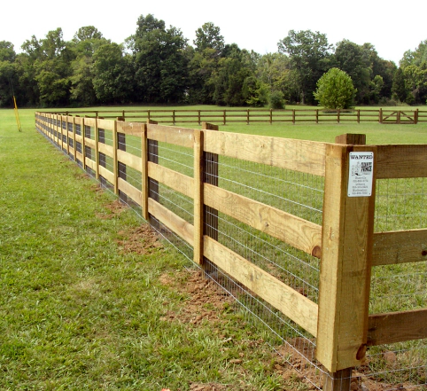brown fence with aluminum barriers between gaps